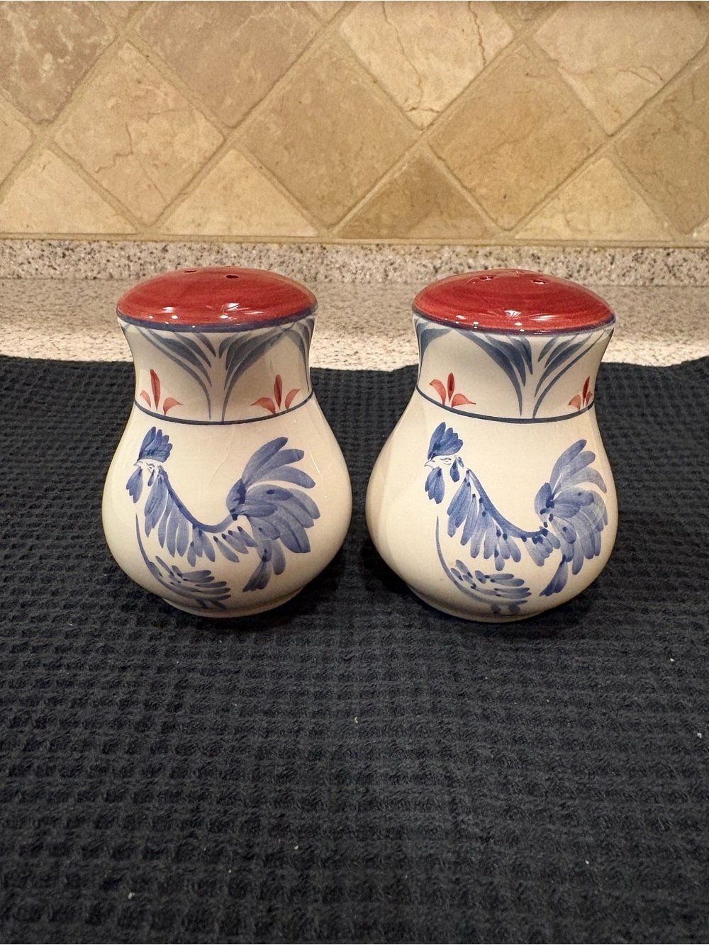 ceramic salt and pepper shaker set featuring a hand-painted blue rooster design